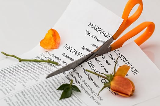 scissors cutting legal document